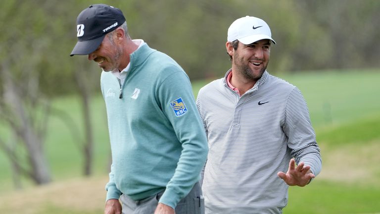 Scottie Scheffler, right, and Matt Kuchar, left, wait for an official to make a ruling after a shot hit by Scheffler hit Kuchar&#39;s ball on the No. 6 green during a semifinal round match at the Dell Technologies Match Play Championship