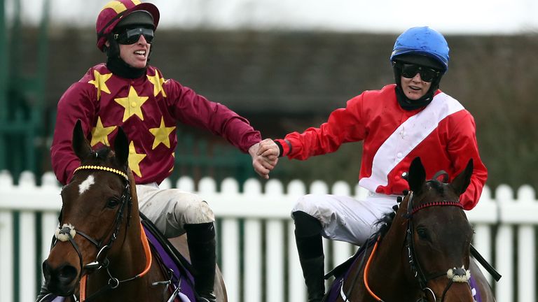 Jack Kennedy riding Minella Indo (left) is congratulated by Rachael Blackmore on A Plus Tard after winning the WellChild Cheltenham Gold Cup