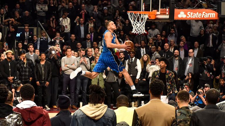 Aaron Gordon collects a pass off the side of the backboard and performs a windmill dunk