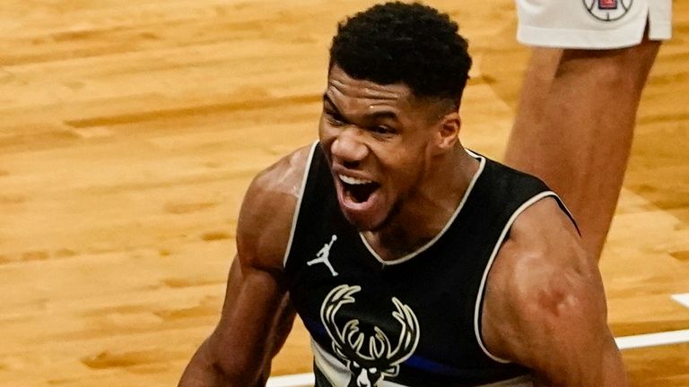 Milwaukee Bucks&#39; Giannis Antetokounmpo reacts after dunking during the second half of an NBA basketball game against the LA Clippers Sunday, Feb. 28, 2021, in Milwaukee. The Bucks won 105-100.