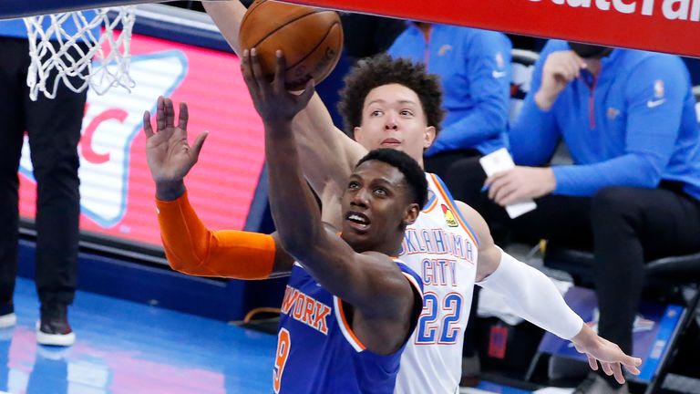 New York Knicks guard RJ Barrett (9) takes a shot against Oklahoma City Thunder center Isaiah Roby (22) during the second half of an NBA basketball game, Saturday, March 13, 2021, in Oklahoma City. (