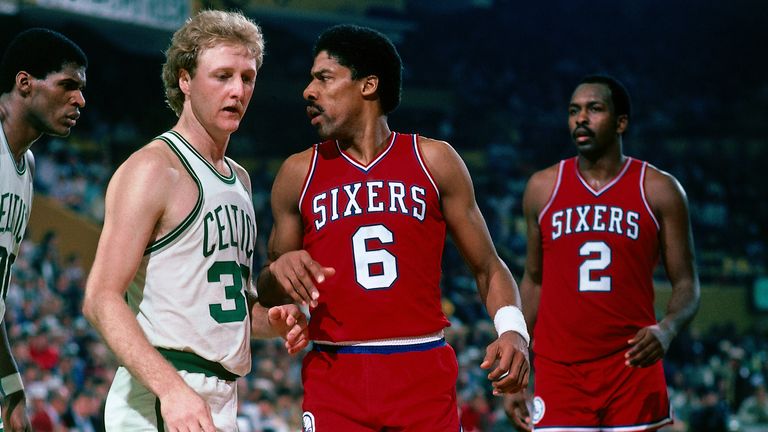 Robert Parish and Larry Bird guard Julius Erving as Moses Malone looks on during a game at the Boston Garden in 1985