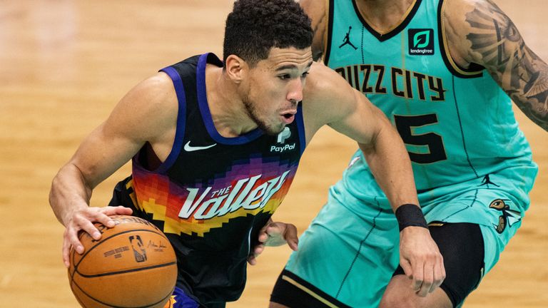 Devin Booker drives towards the basket for the Phoenix Suns