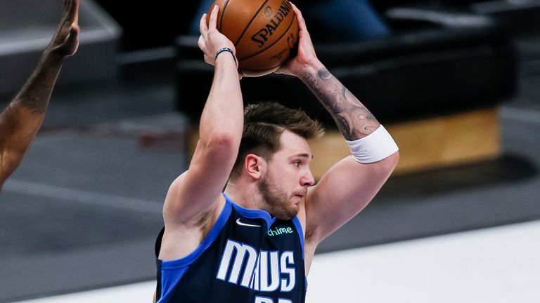 Dallas Mavericks guard Luka Doncic (77) passes during the first half of an NBA basketball game against the Los Angeles Clippers, Monday, March 15, 2021, in Dallas. Los Angeles won 109-99.