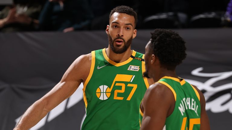 SALT LAKE CITY, UT - MARCH 12: Rudy Gobert #27 and Donovan Mitchell #45 of the Utah Jazz hi-five during the game against the Houston Rockets on March 12, 2021 at vivint.SmartHome Arena in Salt Lake City, Utah. NOTE TO USER: User expressly acknowledges and agrees that, by downloading and or using this Photograph, User is consenting to the terms and conditions of the Getty Images License Agreement. Mandatory Copyright Notice: Copyright 2021 NBAE