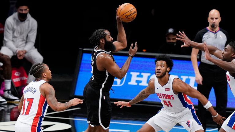 Brooklyn Nets guard James Harden (13) passes the ball as Detroit Pistons forward Saddiq Bey (41), guard Rodney McGruder (17) and center Isaiah Stewart (28) defend during the second half of an NBA basketball game Saturday, March 13, 2021, in New York.