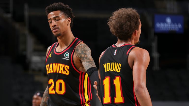 John Collins and Trae Young of the Atlanta Hawks