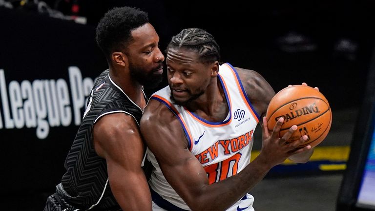 Brooklyn Nets&#39; Jeff Green, left, defends New York Knicks&#39; Julius Randle (30) during the first half of an NBA basketball game Monday, March 15, 2021, in New York.
