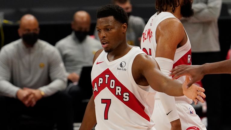 Kyle Lowry shakes hands with teammates during the second half against the Denver Nuggets