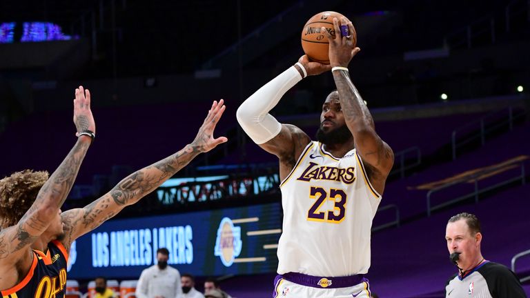 LeBron James #23 of the Los Angeles Lakers shoots the ball during the game against the Golden State Warriors on February 28, 2021 at STAPLES Center in Los Angeles, California.