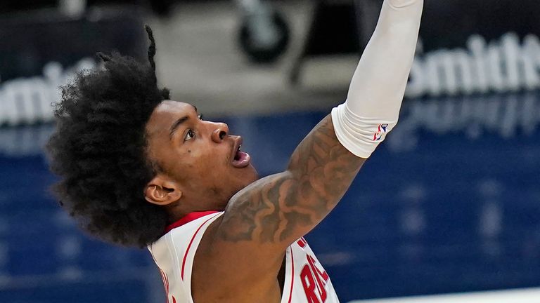 Houston Rockets guard Kevin Porter Jr. lays the ball up during the first half of the team&#39;s NBA basketball game against the Utah Jazz on Friday, March 12, 2021, in Salt Lake City. 