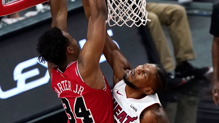 Miami Heat forward Chris Silva, right, blocks a shot by Chicago Bulls center Wendell Carter Jr., during the second half of an NBA basketball game in Chicago, Friday, March 12, 2021. 