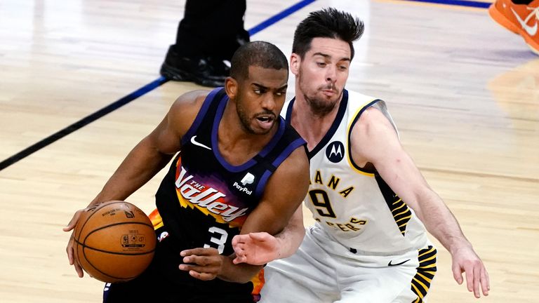 Phoenix Suns guard Chris Paul (3) drives past Indiana Pacers guard T.J. McConnell during the second half of an NBA basketball game Saturday, March 13, 2021, in Phoenix. The Pacers won 122-111. 