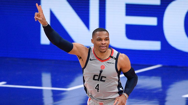 Washington Wizards guard Russell Westbrook (4) gestures after a basket during the first half of an NBA basketball game against the Utah Jazz, Thursday, March 18, 2021, in Washington.