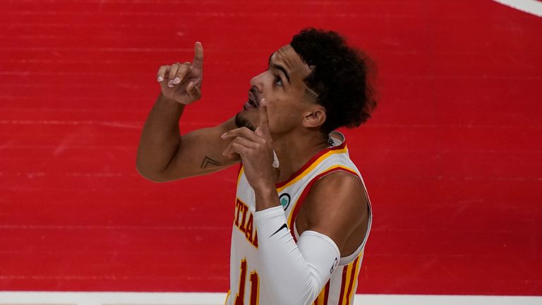 Atlanta Hawks&#39; Trae Young (11) gestures before an NBA basketball game against the Sacramento Kings on Saturday, March 13, 2021, in Atlanta.