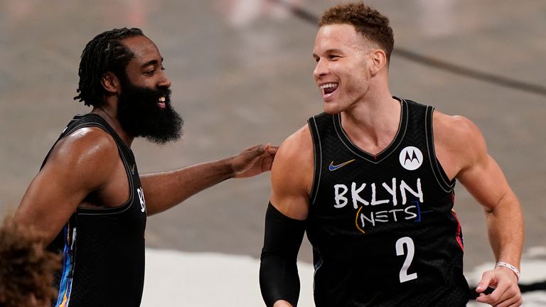 Brooklyn Nets guard James Harden congratulates new teammate Blake Griffin after scoring his first two points as a Net