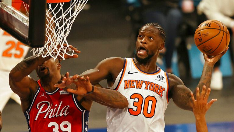 AP - New York Knicks&#39; Julius Randle (30) heads for the net as Philadelphia 76ers&#39; Dwight Howard (39) defends