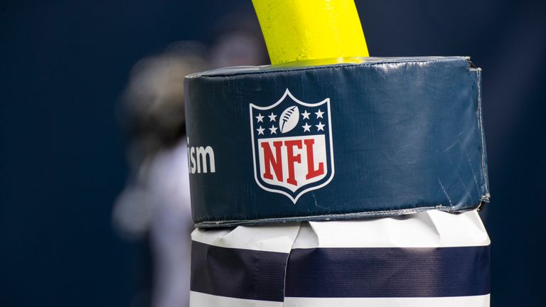 AP - Detail view of NFL shield logo on a goal post pad before an NFL wild-card playoff football game between the Tennessee Titans and the Baltimore Ravens, Sunday, Jan. 10, 2021, in Nashville, Tenn. (AP Photo/Brett Carlsen)