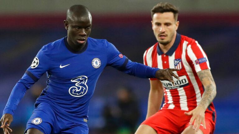 Chelsea's N'Golo Kante, left, is challenged by Atletico Madrid's Saul