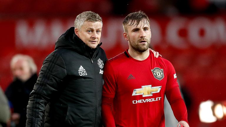 Manchester United manager Ole Gunnar Solskjaer with left-back Luke Shaw