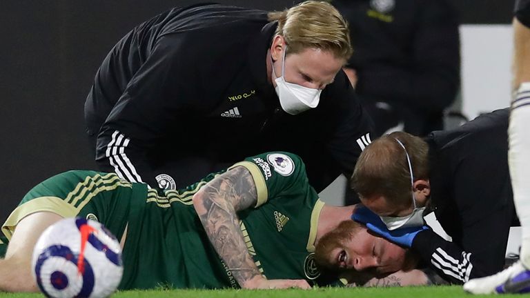 Sheffield United forward Oli McBurnie is treated for a head injury (AP image)