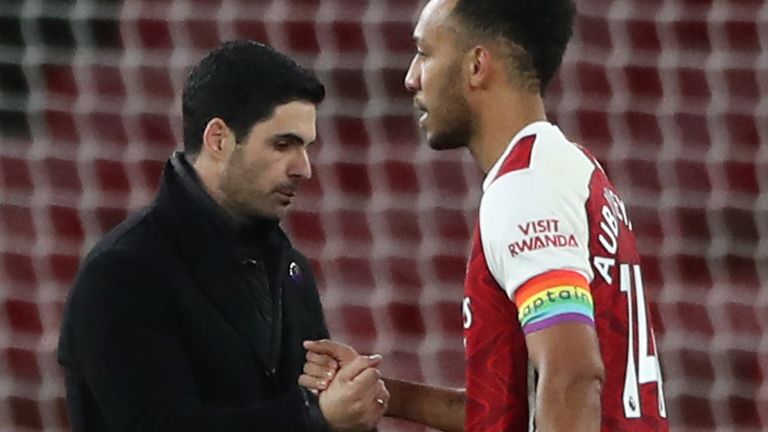 Arsenal manager Mikel Arteta (left) consoles captain Pierre-Emerick Aubameyang 