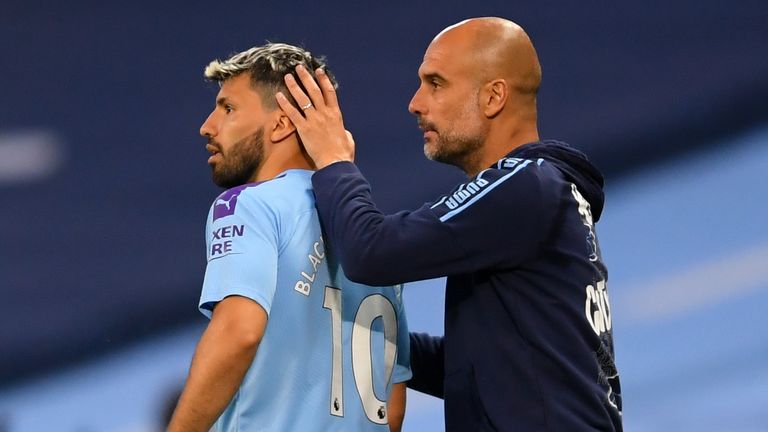 PA - Manchester City striker Sergio Aguero and manager Pep Guardiola