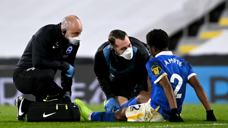 PA - Brighton defender Tariq Lamptey receives treatment on the pitch
