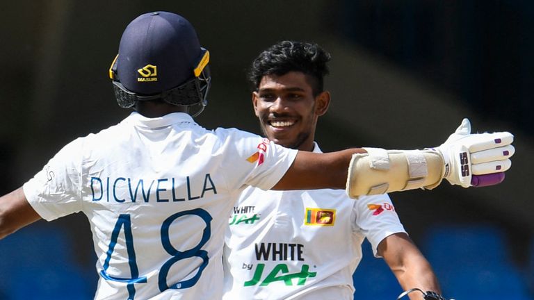 Getty - Niroshan Dicwella (L) congratulates Pathum Nissanka (R) of Sri Lanka on reaching his century during day 4 of the 1st Test between West Indies and Sri Lanka at Vivian Richards Cricket Stadium in North Sound, Antigua and Barbuda, on March 24, 2021. (Photo by Randy Brooks / AFP) (Photo by RANDY BROOKS/AFP via Getty Images)