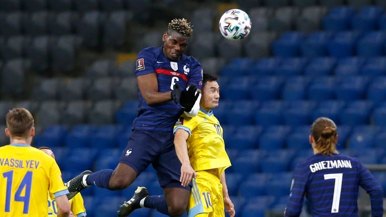 Paul Pogba rises to win the ball for France in the World Cup Qualifier