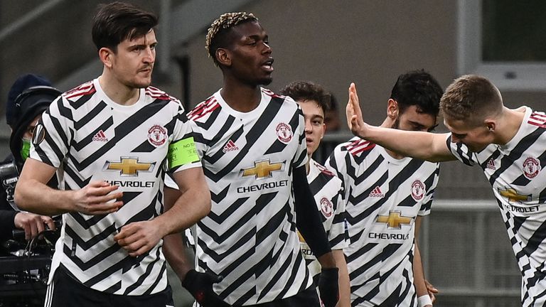 Paul Pogba is congratulated after opening the scoring for Manchester United in Milan