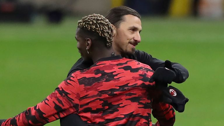 Paul Pogba and Zlatan Ibrahimovic embrace on the touchline at the San Siro