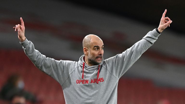 Manchester City manager Pep Guardiola reacts during the Premier League match at the Emirates Stadium, London. Picture date: Sunday February 21, 2021.