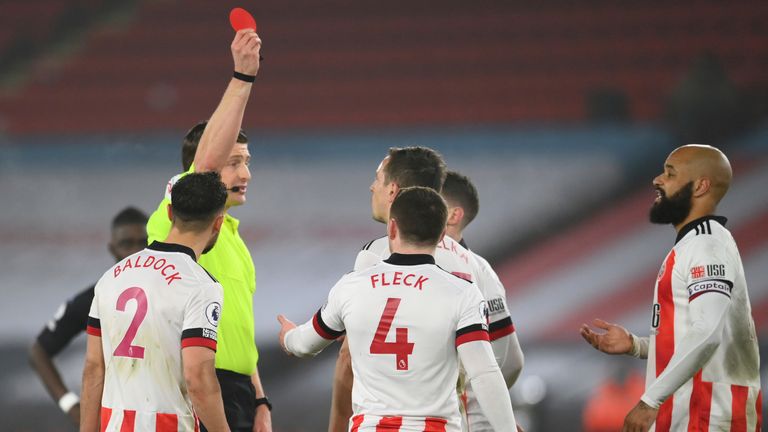 Sheffield United's Phil Jagielka is shown a red card (AP)