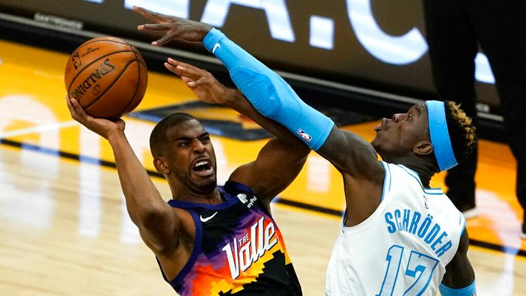 AP - Phoenix Suns guard Chris Paul gets fouled by Los Angeles Lakers guard Dennis Schroder (17)