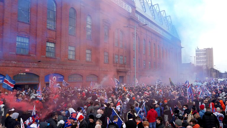 Rangers fans celebrate outside of the Ibrox Stadium after Rangers win the Scottish Premiership title. Picture date: Sunday March 7, 2021.