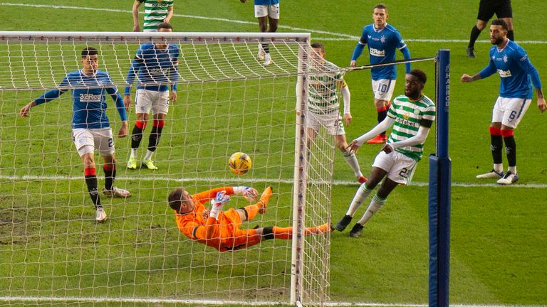 Celtic's Odsonne Edouard sees his shot saved by Rangers' Allan McGregor (left)
