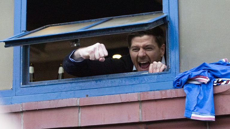 Rangers v St Mirren - Scottish Premiership - Ibrox Stadium
Rangers manager Steven Gerrard hangs out the window of the dressing room to cheer with fans gathered outside the stadium after the Scottish Premiership match at Ibrox Stadium, Glasgow. Picture date: Saturday March 6, 2021.