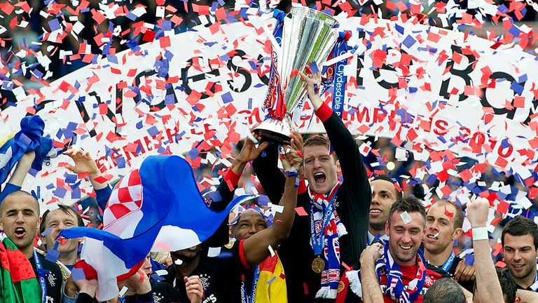 15/05/11 CLYDESDALE BANK PREMIER LEAGUE.KILMARNOCK v RANGERS.RUGBY PARK - KILMARNOCK.Rangers ace Steven Davis leads the celebrations as his side clinch three SPL titles in a row