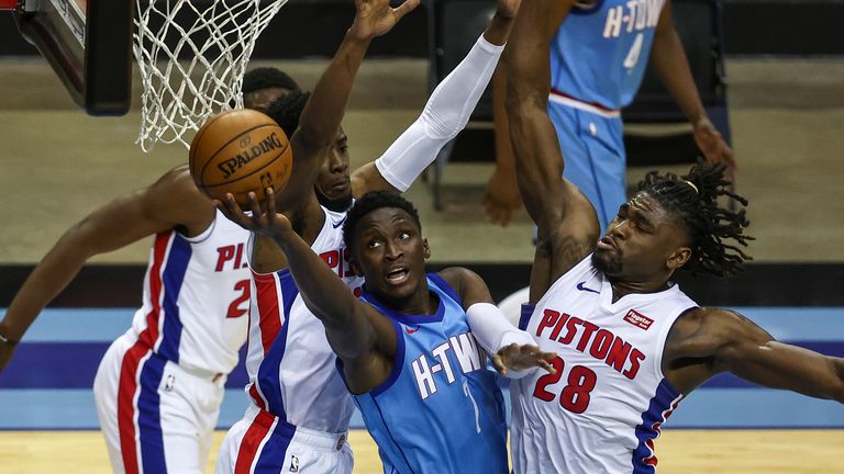 Houston Rockets guard Victor Oladipo shoots the ball as Detroit Pistons center Isaiah Stewart defends