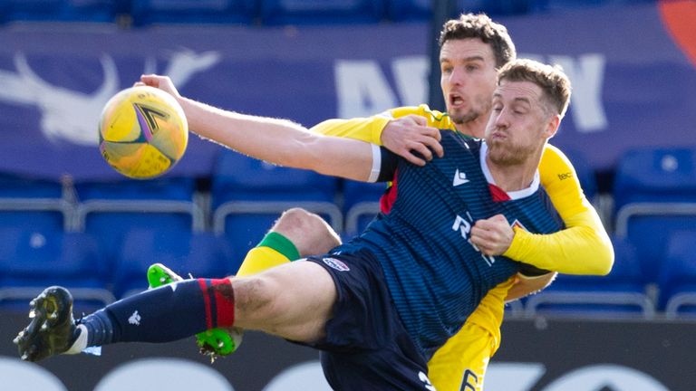 Ross County's Jordan White and Hibernian's Paul McGinn in Dingwall