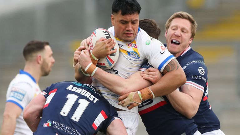 Leeds' Zane Tetevano is tackled by Wakefield's Matty Ashurst, Jordan Crowther and Chris Green