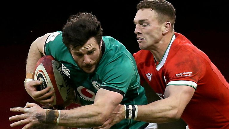 Robbie Henshaw is tackled by George North