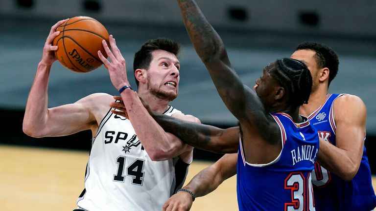 AP - San Antonio Spurs forward Drew Eubanks (14) drives to the basket against New York Knicks forward Julius Randle (30