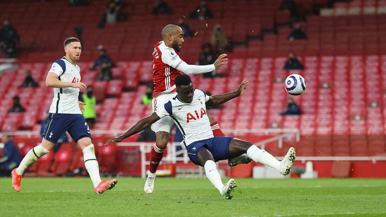 Davinson Sanchez gave away a penalty for this foul on Alexandre Lacazette