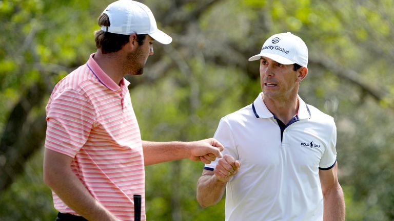 Scottie Scheffler, left, congratulates Billy Horschel after Horschel chipped in for a birdie to win hole No. 5 during the final round of the Dell Technologies Match Play Championship 