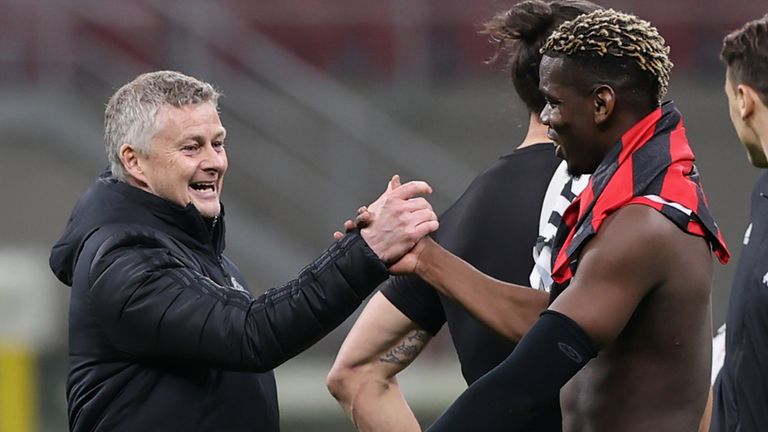 Ole Gunnar Solskjaer greets Paul Pogba after the win in Milan
