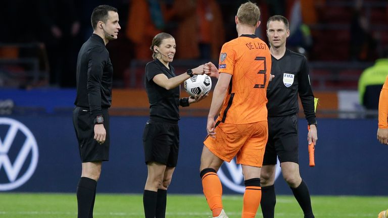 Frappart greets Netherlands defender Matthijs de Ligt