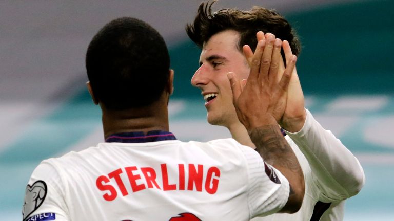 Mason Mount celebrates with Raheem Sterling