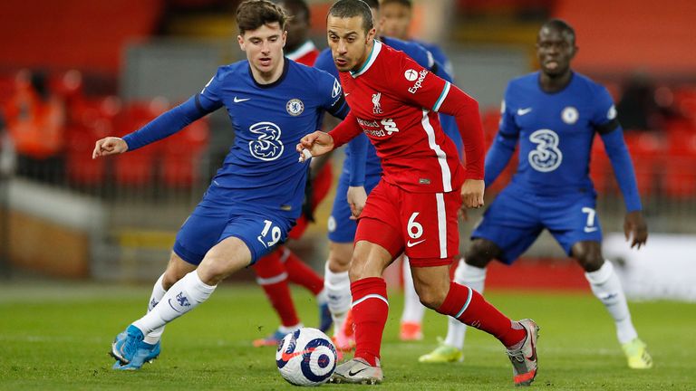 Thiago challenges for the ball with Chelsea's Mason Mount (AP)